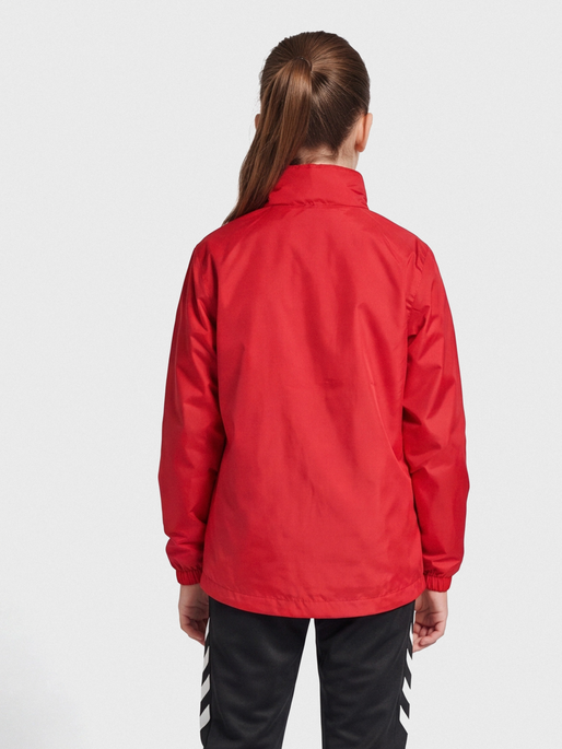 hmlPROMO RAIN JACKET KIDS, TRUE RED, model