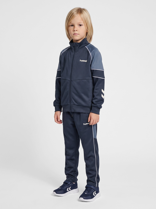 hmlJR REG POLY BLOCK ZIP JACKET, OMBRE BLUE, model
