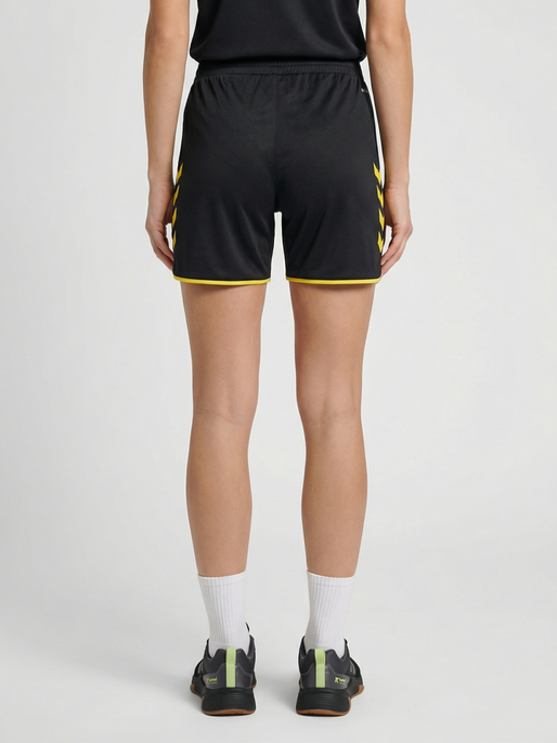 hmlCORE 2.0 SHORTS WOMAN, BLACK/BLAZING YELLOW, model