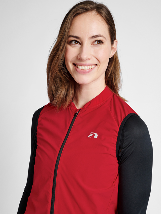 WOMENS CORE BIKE GILET, TANGO RED, model